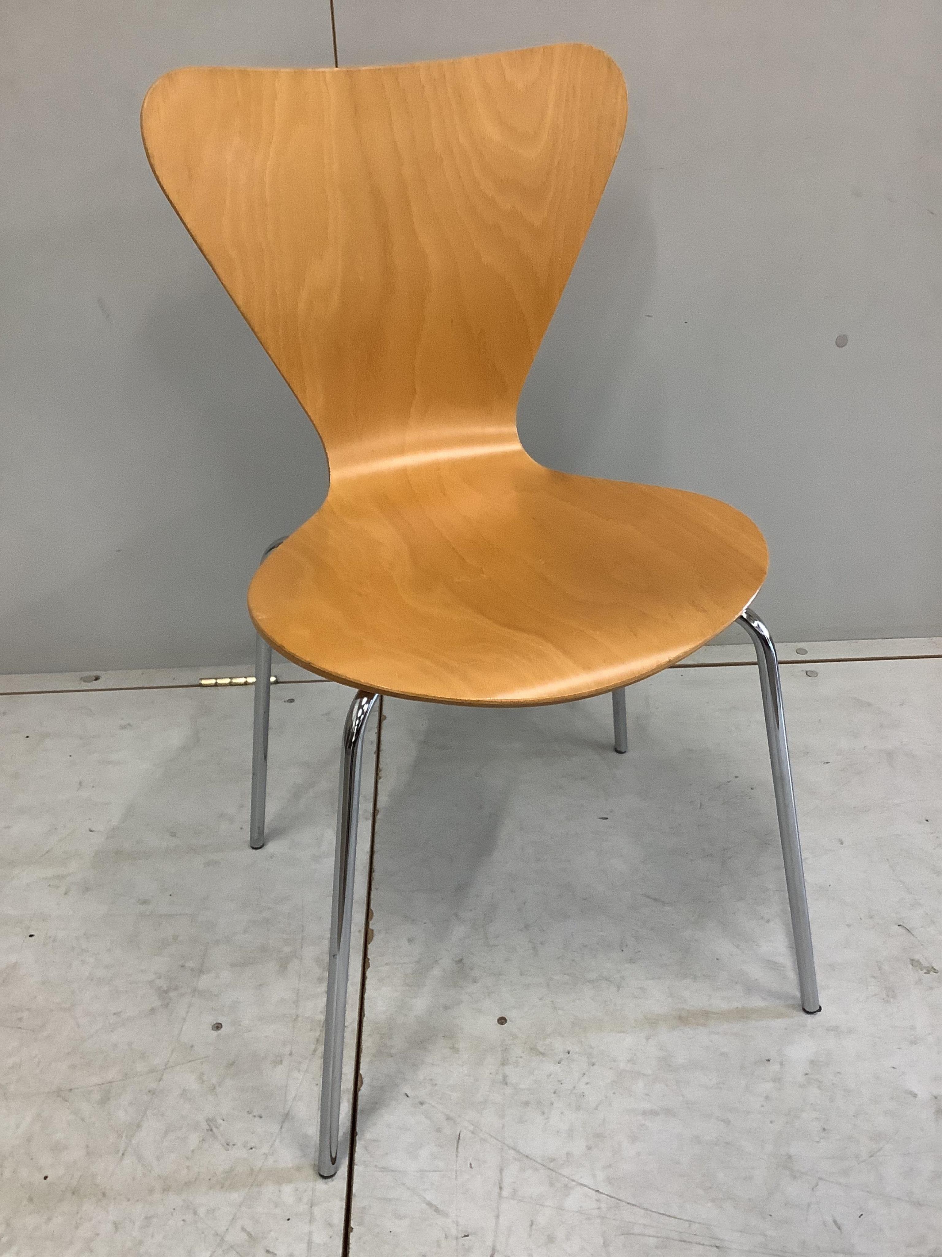 A set of four Arne Jacobsen style bent ply and chrome stacking chairs, width 45cm, depth 40cm, height 81cm. Condition - fair to good